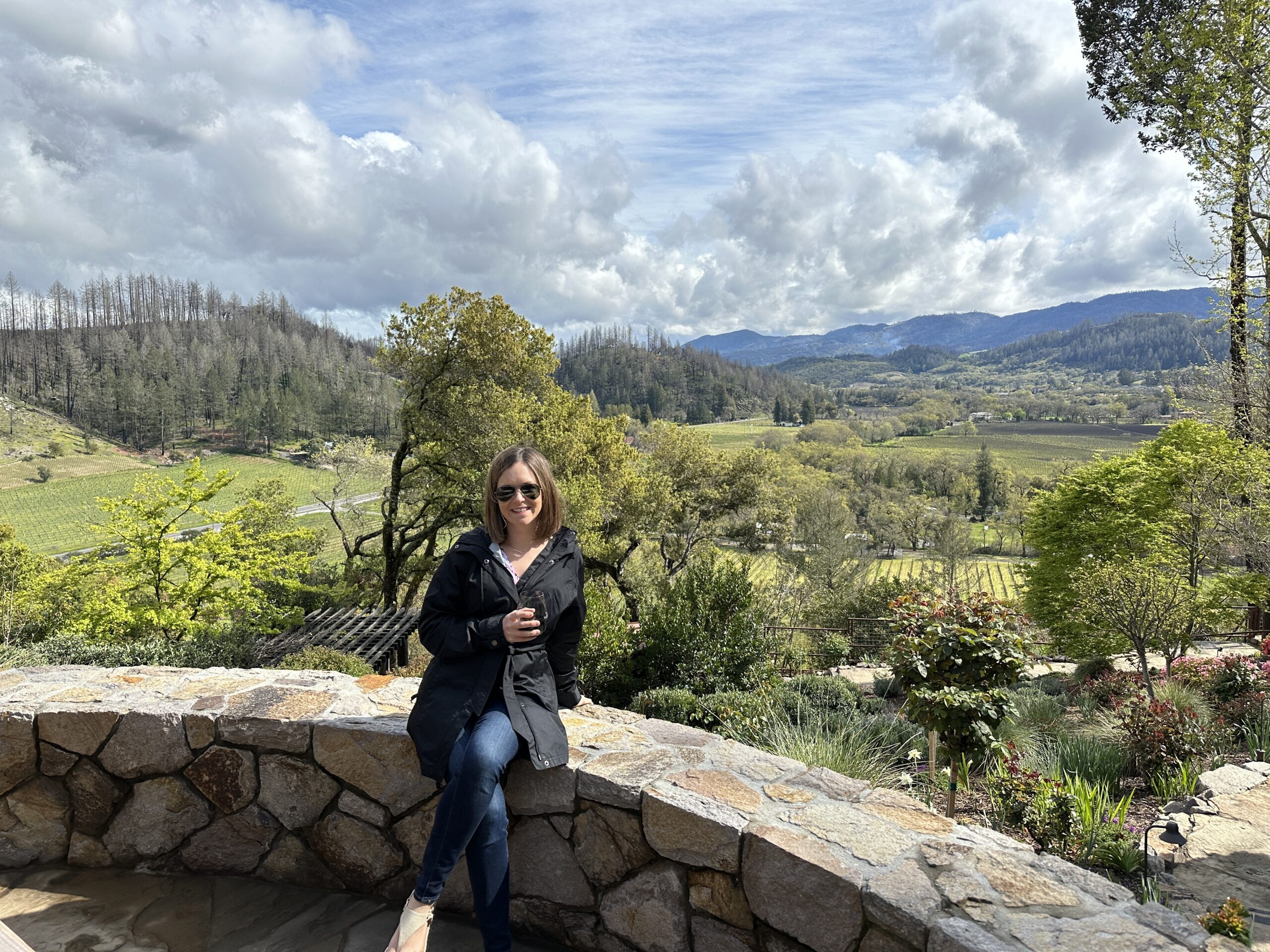 Ashley enjoying a vineyard view in Napa Valley, California